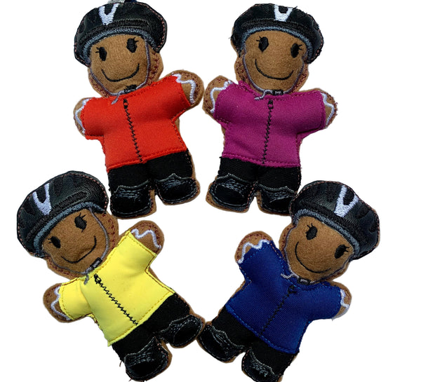 Cyclist gingerbread decoration in pink, red, yellow or blue top.