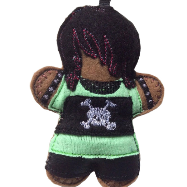 Goth boy, gingerbread decoration. Dressed in green top and black trousers on white background.