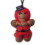 Machine embroidered felt gingerbread decoration dressed as a goth girl in red and black glossy outfit, on white background.