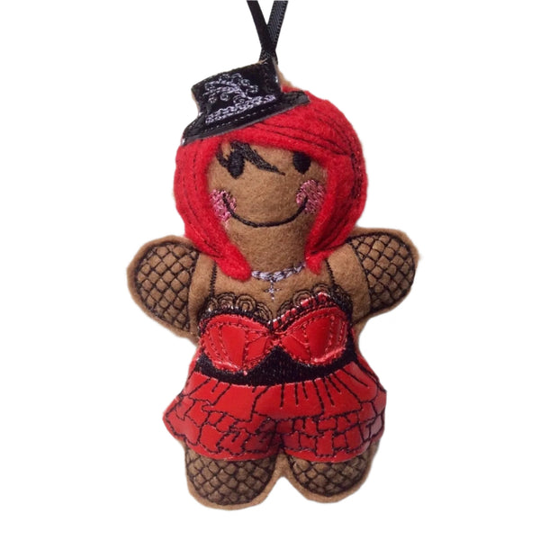 Machine embroidered felt gingerbread decoration dressed as a goth girl in red and black glossy outfit, on white background.