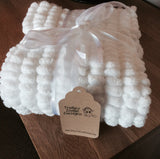 White pram blanket.