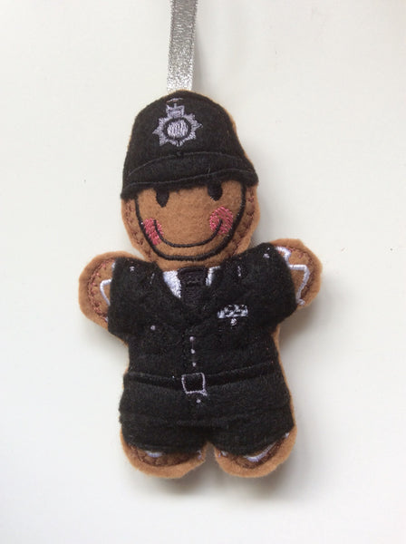 Policeman felt gingerbread man decoration. Lightly filled, hand sewn finish.