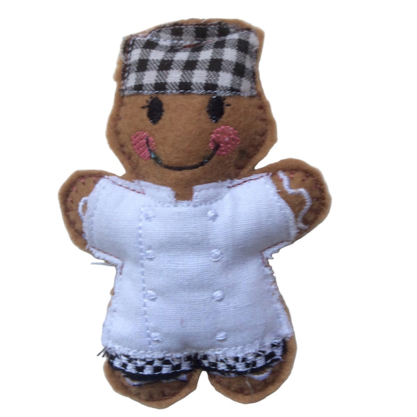 Chef felt gingerbread man decoration in white uniform and black and white chefs hat. 