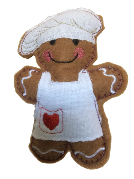 Gingerbread man decoration with a chef's hat and apron.