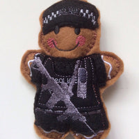 Armed police officer felt gingerbread decoration in black uniform.