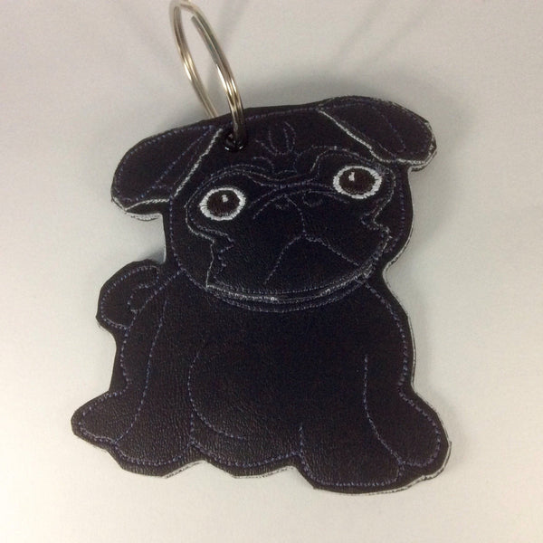 Black pug keyring. In a sparkly vinyl finish.