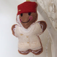 Flight attendant machine embroidered felt gingerbread Christmas tree decoration. Cream and red uniform