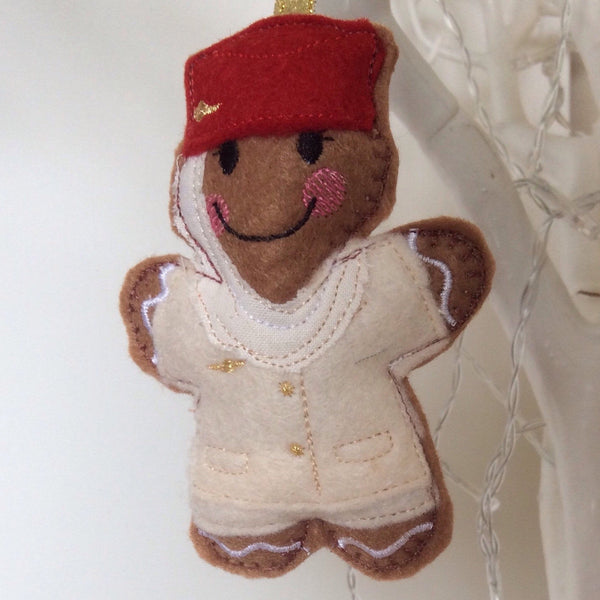 Flight attendant machine embroidered felt gingerbread Christmas tree decoration. Cream and red uniform