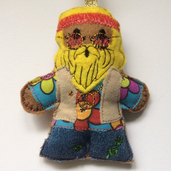 Hippie  felt gingerbread man decoration.  Lightly filled with a polyester stuffing to create depth and character. Hand sewn to finish. 