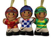 Jockey, machine embroidered felt gingerbread man Christmas decoration. Available in blue check, green stripe or red star design