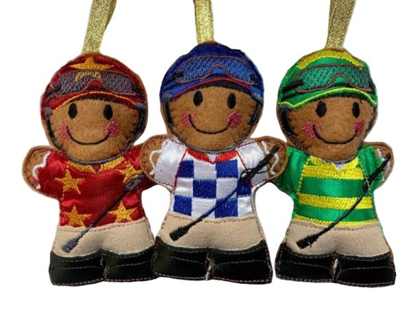 Jockey, machine embroidered felt gingerbread man Christmas decoration. Available in blue check, green stripe or red star design