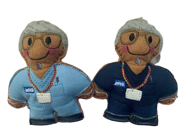 Male nurse gingerbread men, felt  decorations in navy or light blue scrubs on a white background 