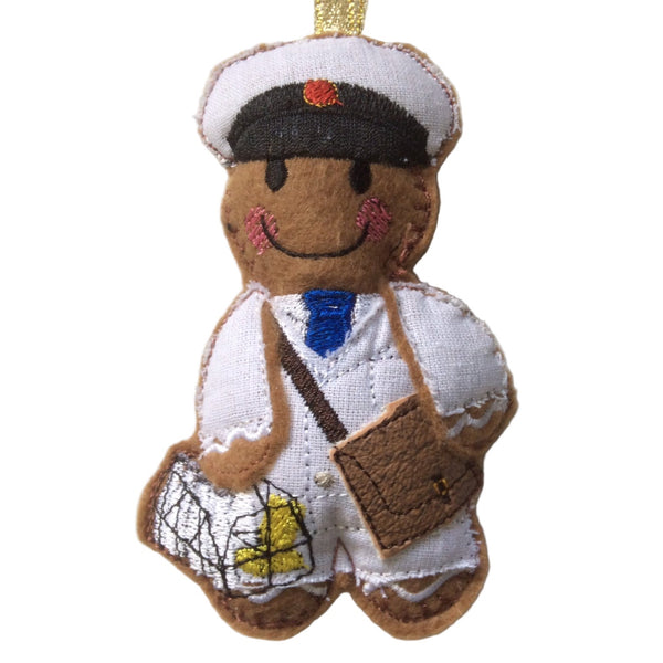 Felt gingerbread man decoration in white milkman's uniform, designed as a Christmas ornament.