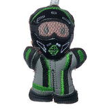 Moto GP gingerbread man decoration, dressed in black glossy vinyl helmet and grey faux leather suit, boots and gloves. on white background.