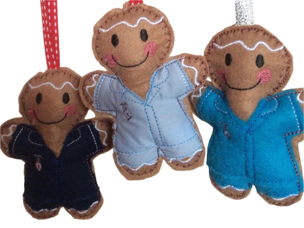 Gingerbread man decoration in a nurse's scrubs, on white background.