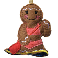 Paddle boarding girl gingerbread decoration.