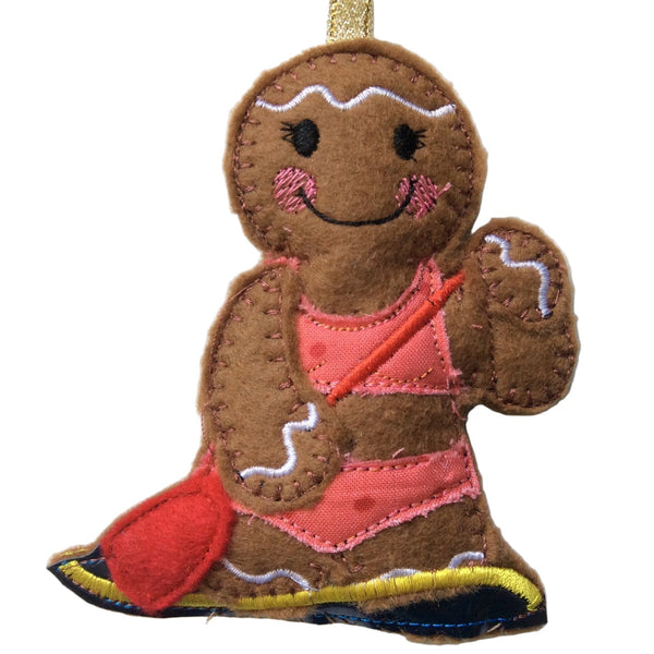 Paddle boarding girl gingerbread decoration.