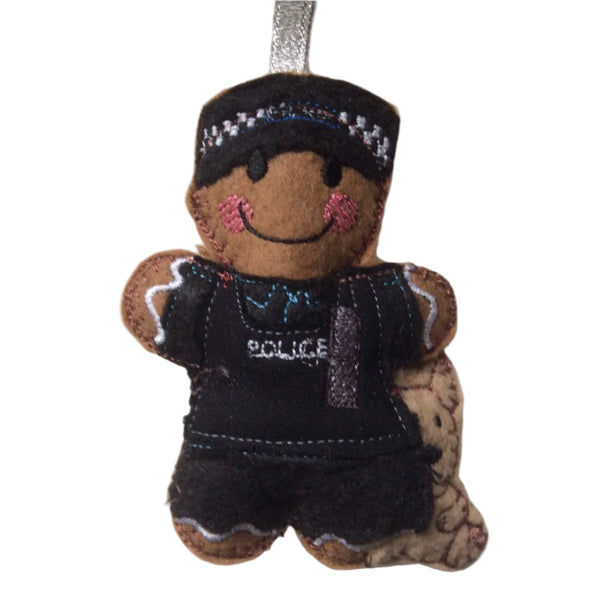 Gingerbread man police dog handler decoration, on white background hanging from a silver ribbon.