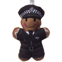 Decorative gingerbread man decoration wearing a police uniform on a white background