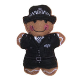 Policewoman gingerbread man in traditional uniform on white background