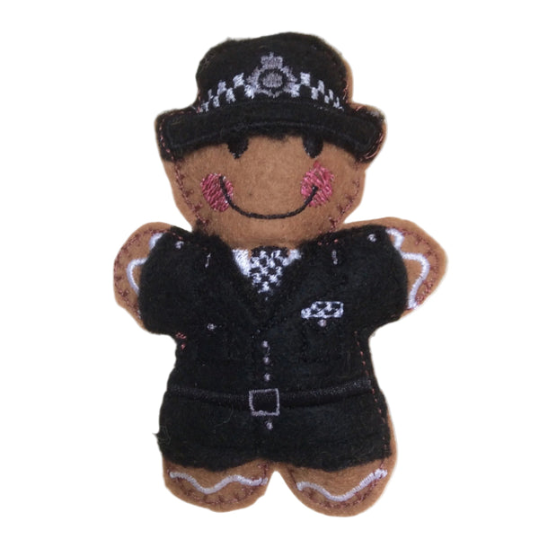 Policewoman gingerbread man in traditional uniform on white background