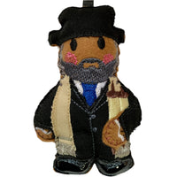 Rabbi in traditional dress, felt gingerbread decoration on white background.