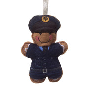 A gingerbread man decoration in a RAF dress uniform, with a hat and tie, made from felt.