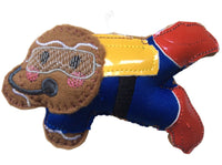 A handmade felt gingerbread man with a scuba diver theme, featuring a brown body, yellow  tank, red flippers and blue scuba suit, designed as a Christmas tree ornament.