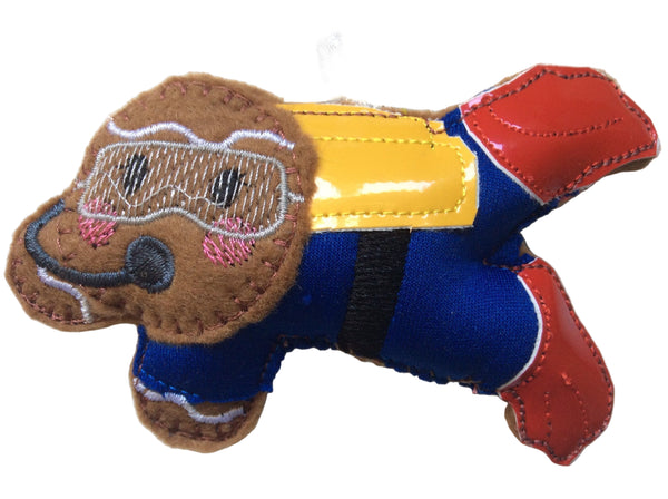 A handmade felt gingerbread man with a scuba diver theme, featuring a brown body, yellow  tank, red flippers and blue scuba suit, designed as a Christmas tree ornament.