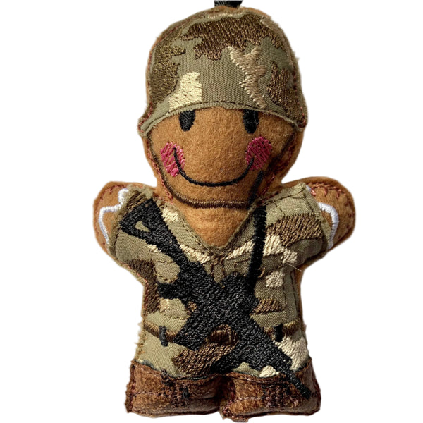 Gingerbread soldier felt decoration with gun and helmet.