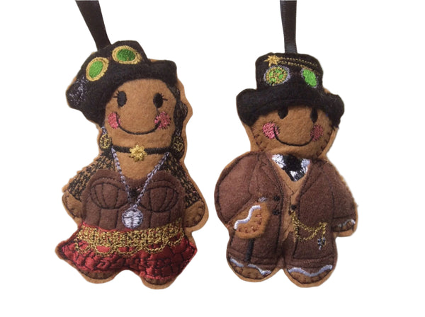 Two felt gingerbread man and woman decorations in steampunk fashion, with decorative details such as hats and chains, designed as ornaments.