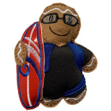 Surfer Boy Gingerbread Man Decoration. Dressed in black wetsuit with blue detail, holding a red surfboard. Displayed on white background.