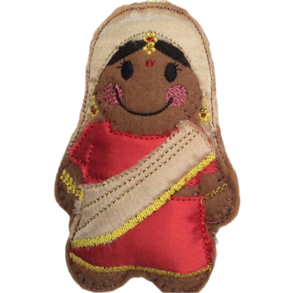 A felt gingerbread ornament dressed as an Indian bride with traditional wedding attire, featuring gold, beige, and red colours with decorative details.