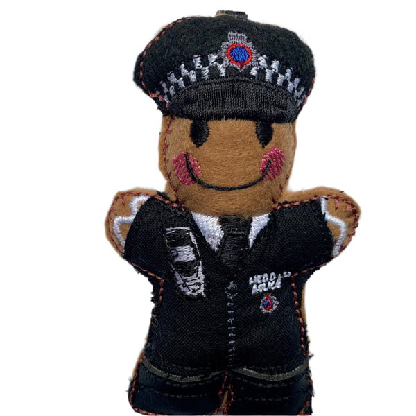 South Wales police officer machine embroidered felt gingerbread decoration. On white background.